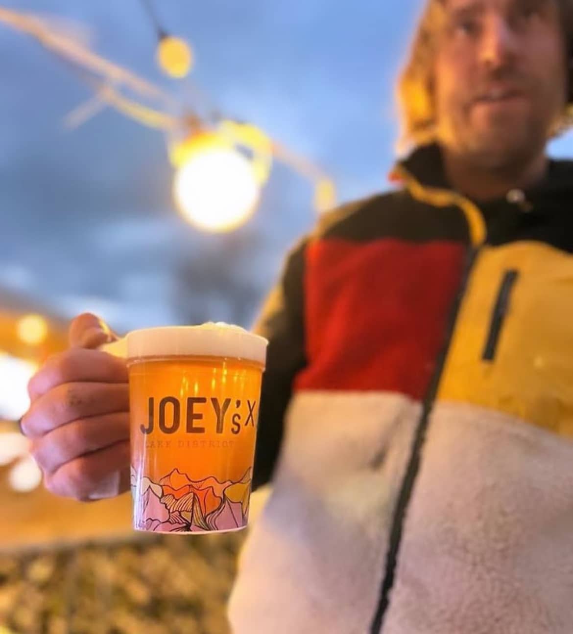 Durable printed pint cups on a busy bar
